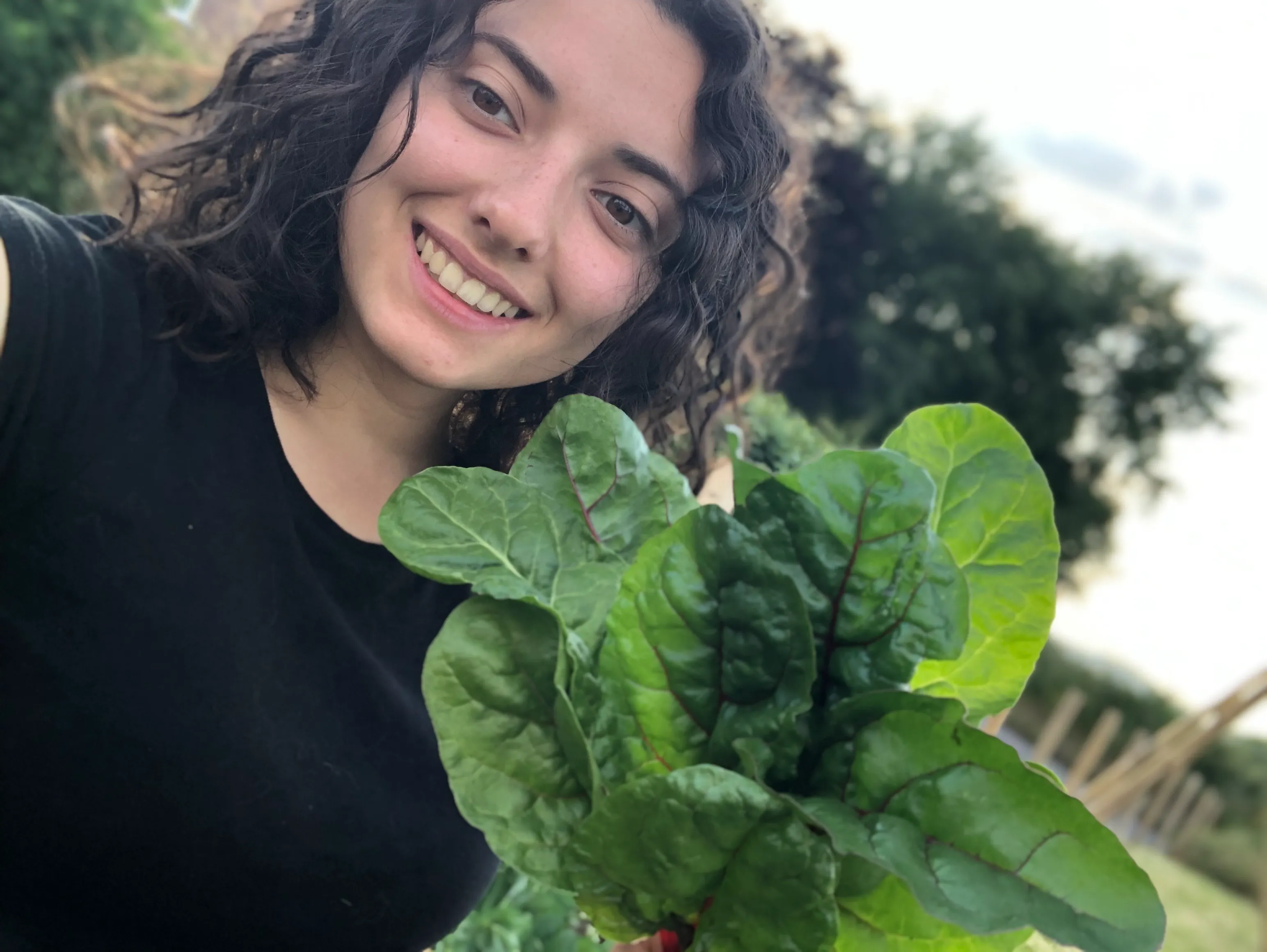 Emily with a plant.